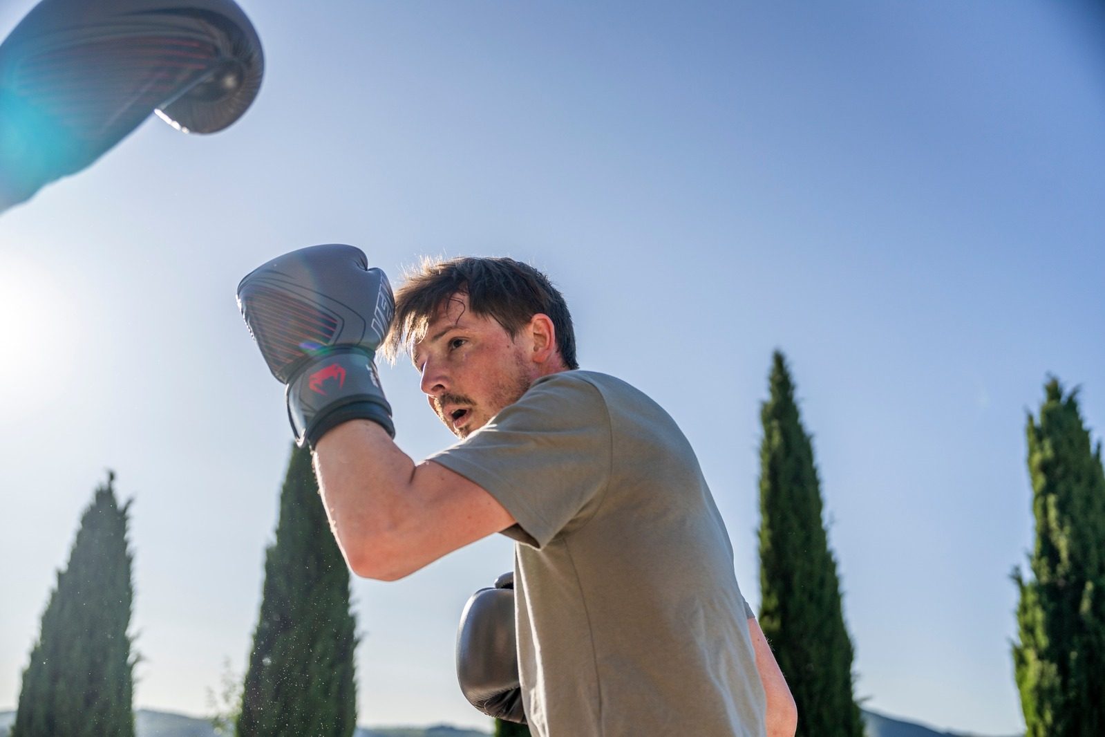 Boxing session with cypress trees